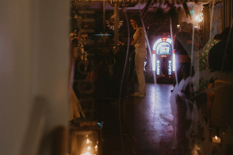Young bride stood talking to wedding guests during the evenings entertainment
