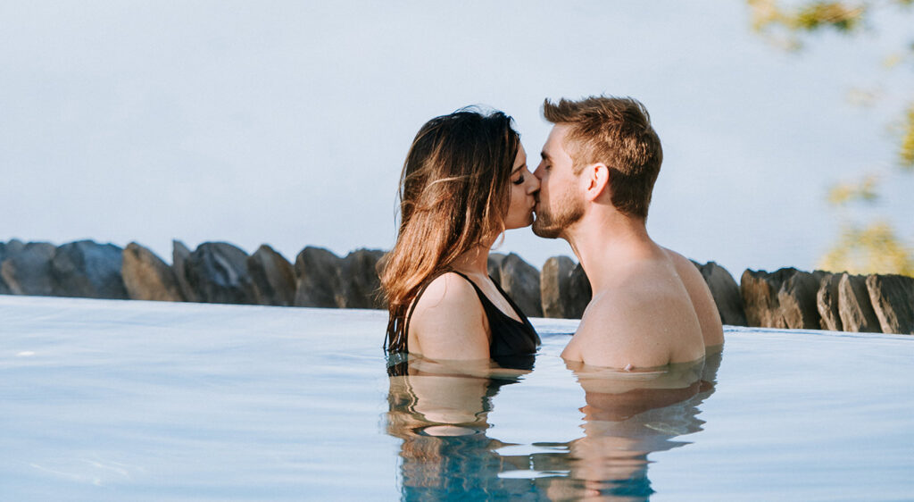 Couple in the outdoor pool at The Spa at Low Wood Bay.