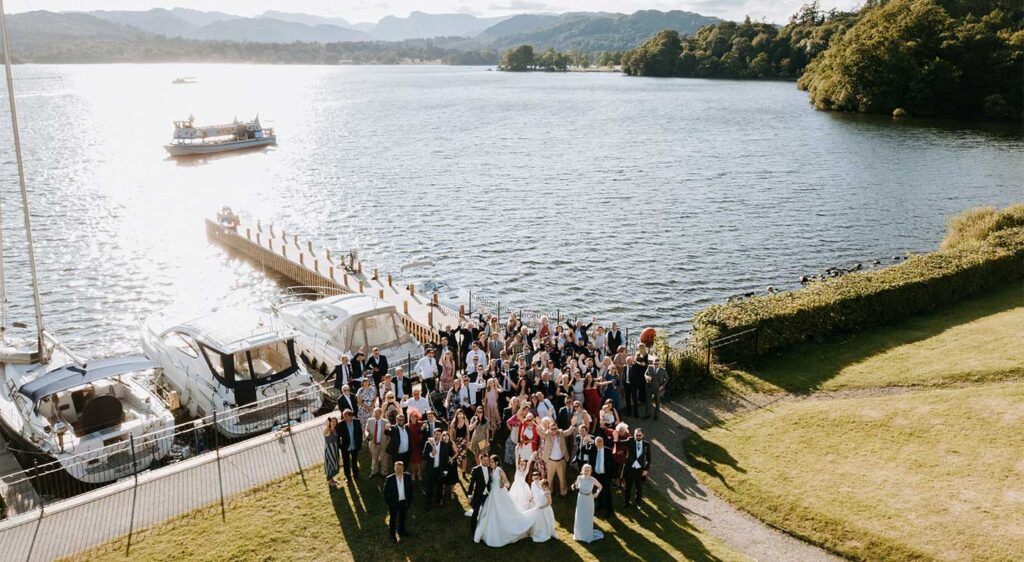 Wedding party on the lakeside lawns at Low Wood Bay Resort & Spa
