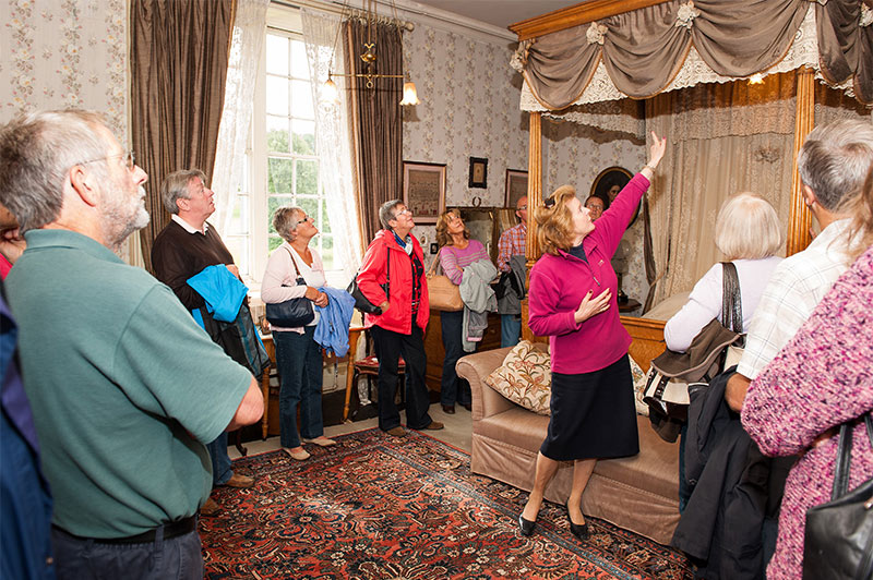 Guided tour in one of Leighton Hall's bedrooms.