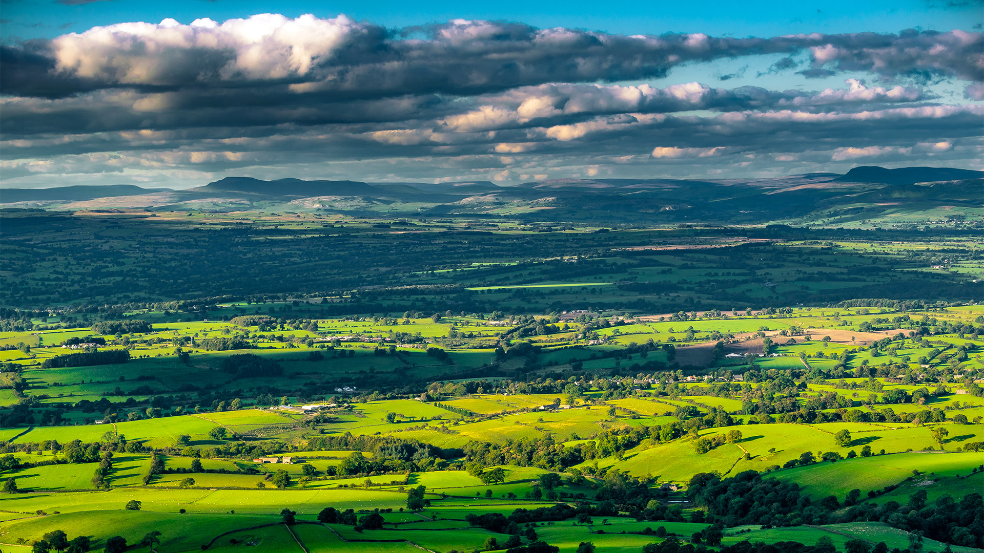 Sun dappled views across to the Pendle Hill.